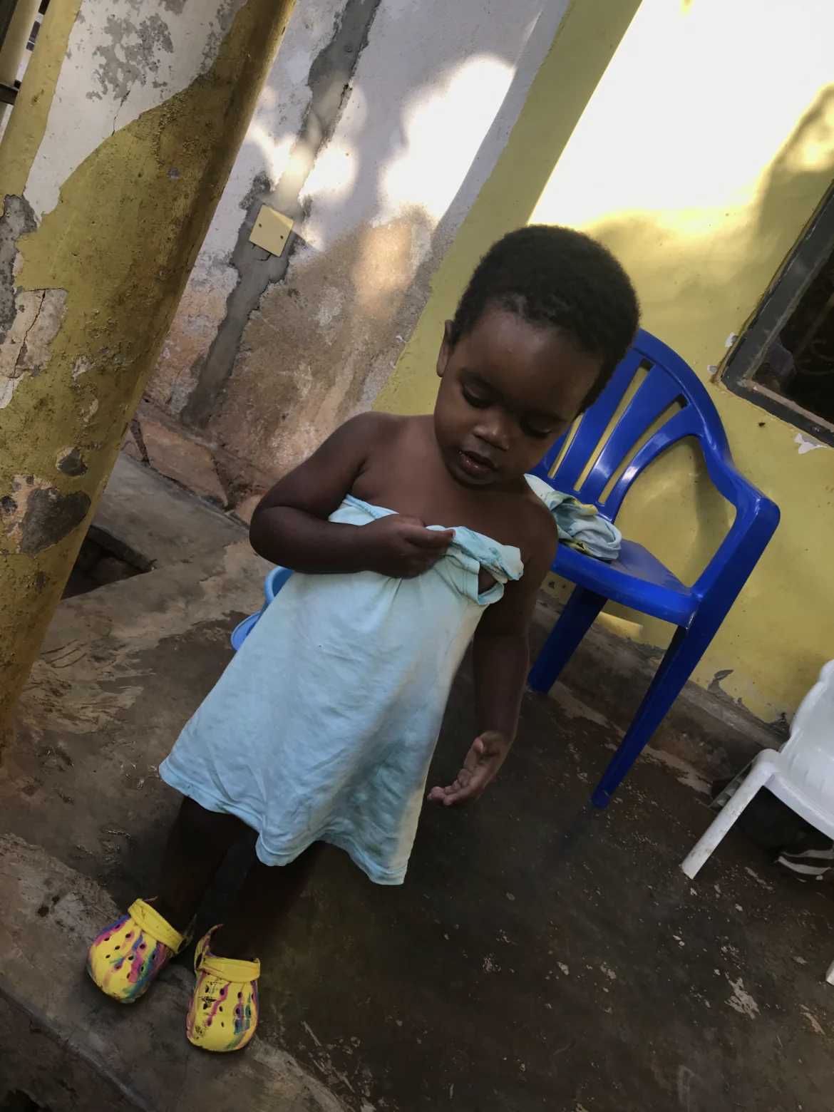 A young child in a towel