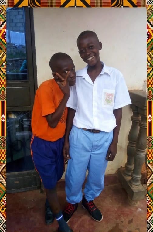 Two students standing together in school uniform